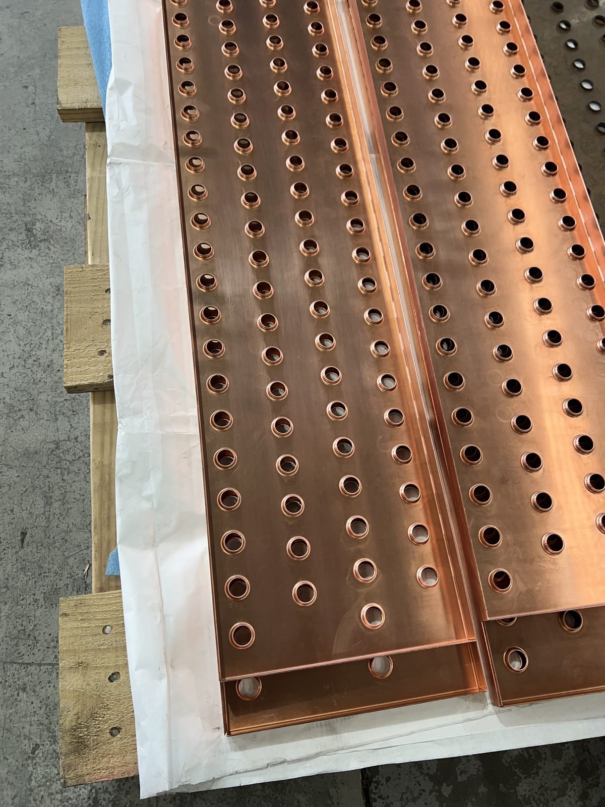 Copper bus bars with CNC-punched holes