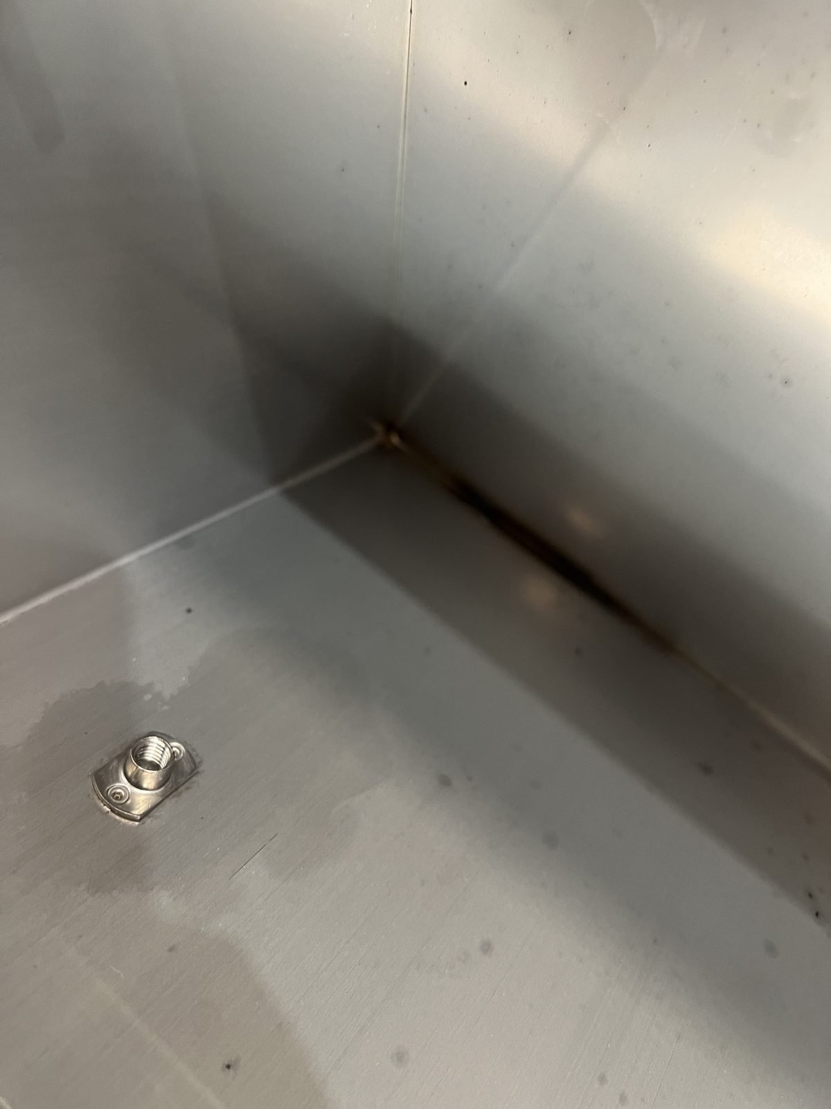 Close-up TIG-welded stainless corner joint